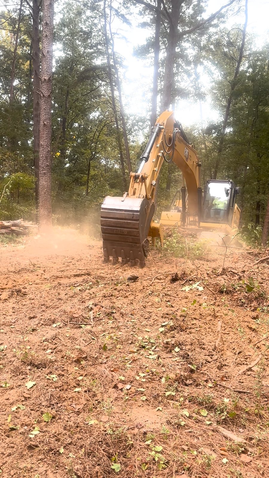 Archon excavator clearing trees on a Gardendale, AL property — work in progress